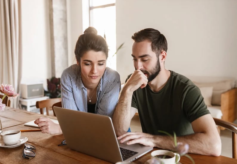 couple looking into healthcare on computer
