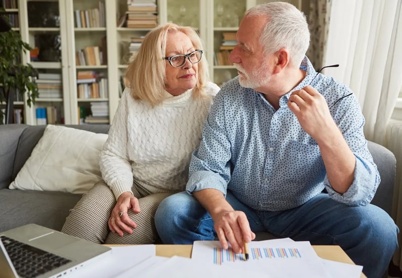 older couple comparing costs
