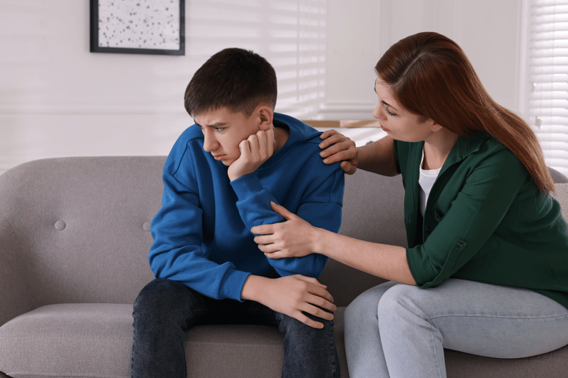 mother consoling teen with anxiety