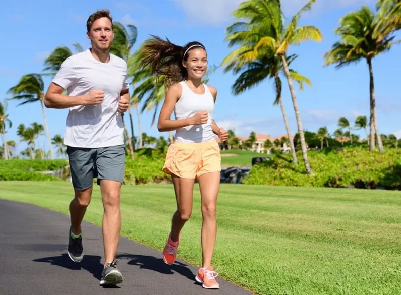 man and woman outside running