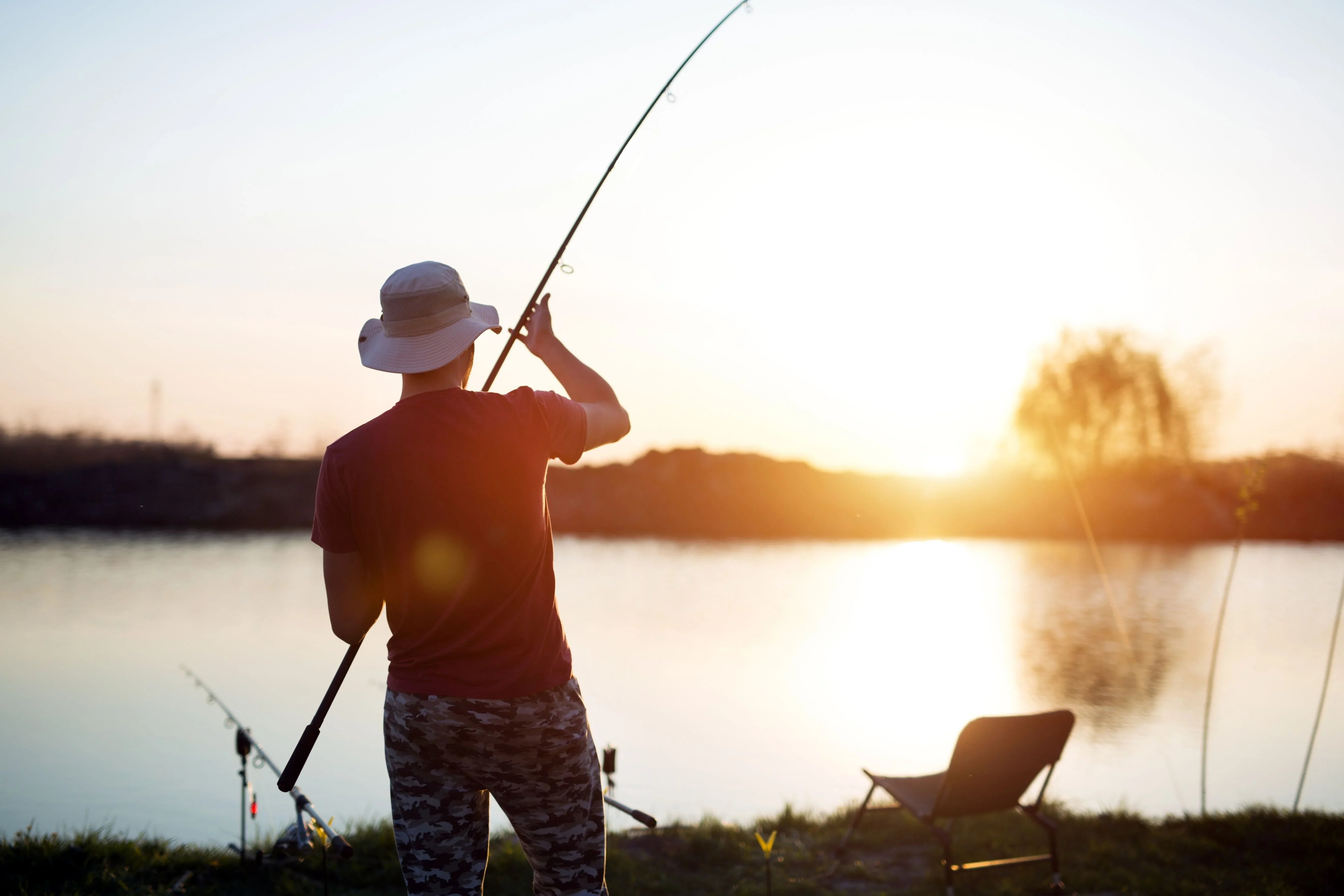 man fishing at lake