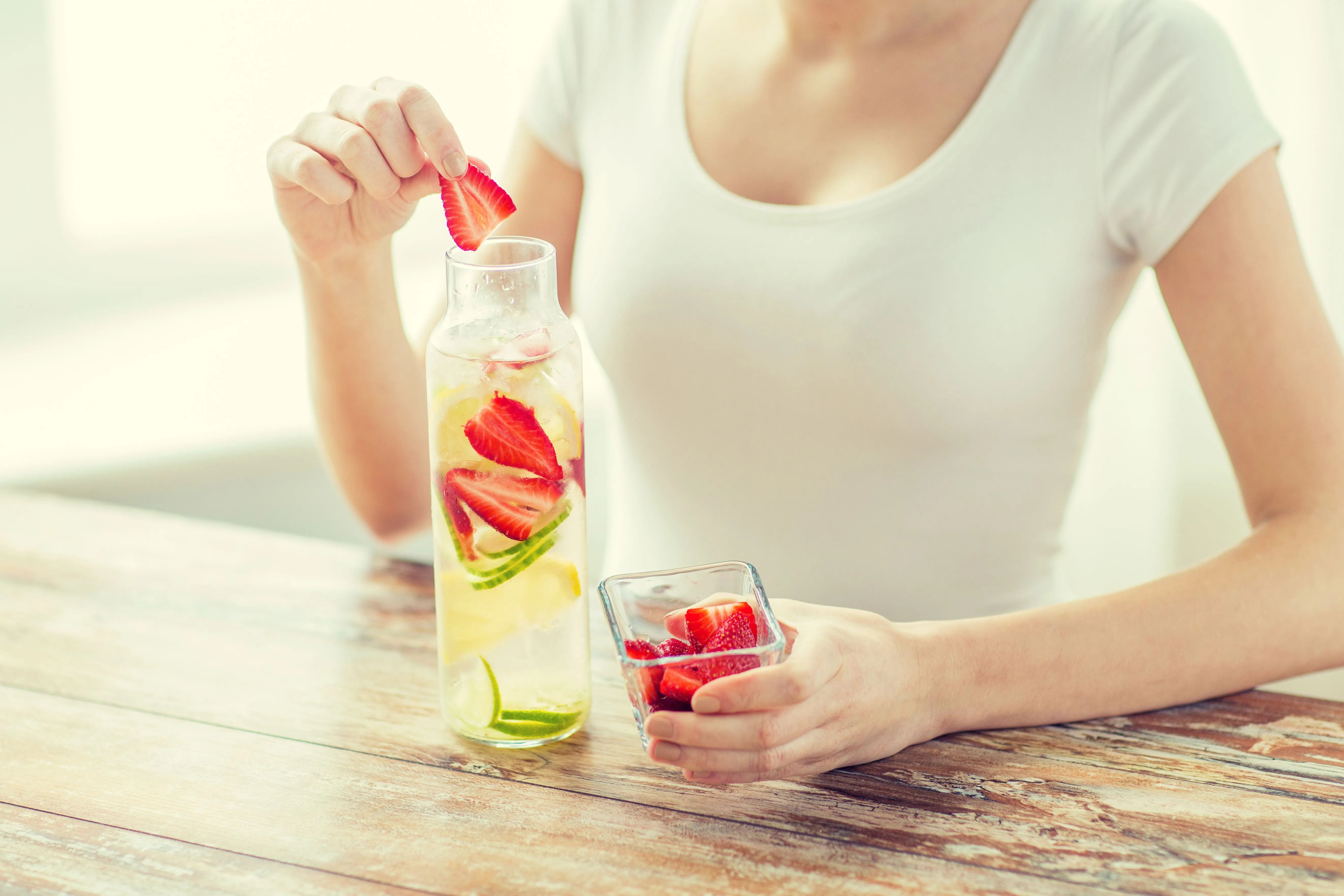 adding fruit to water bottle