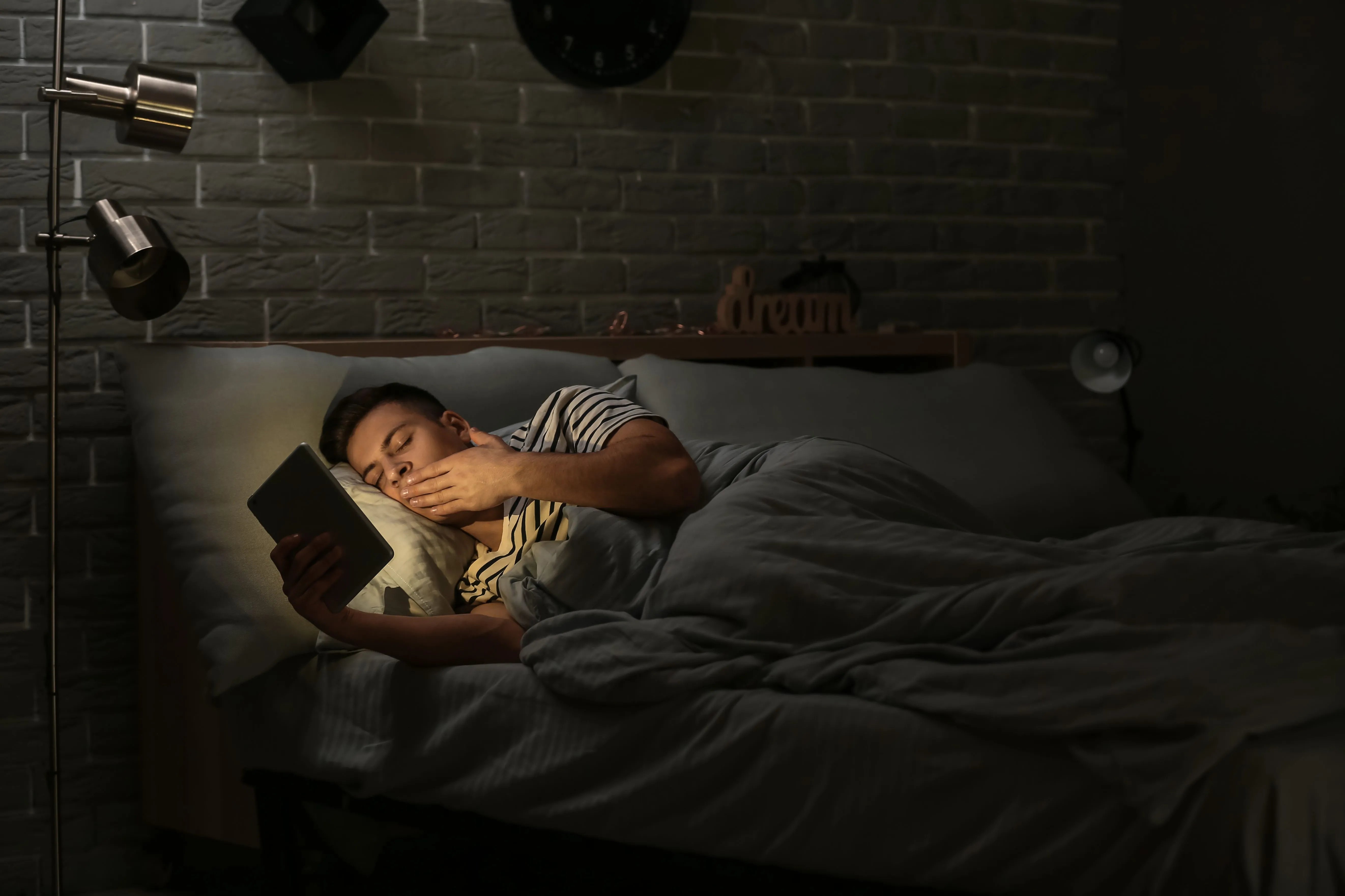 man falling asleep reading