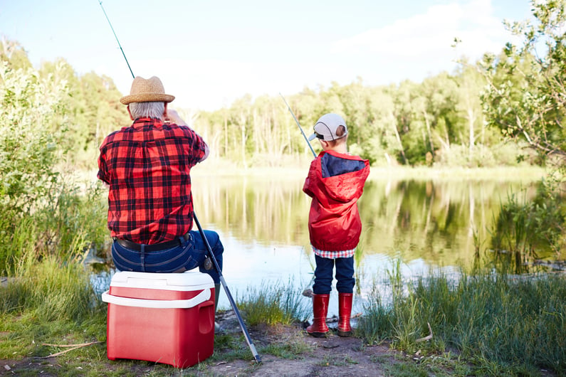young bpy fishing with grandpa
