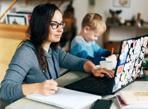 Woman sitting down budgeting