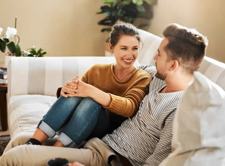 couple talking on couch