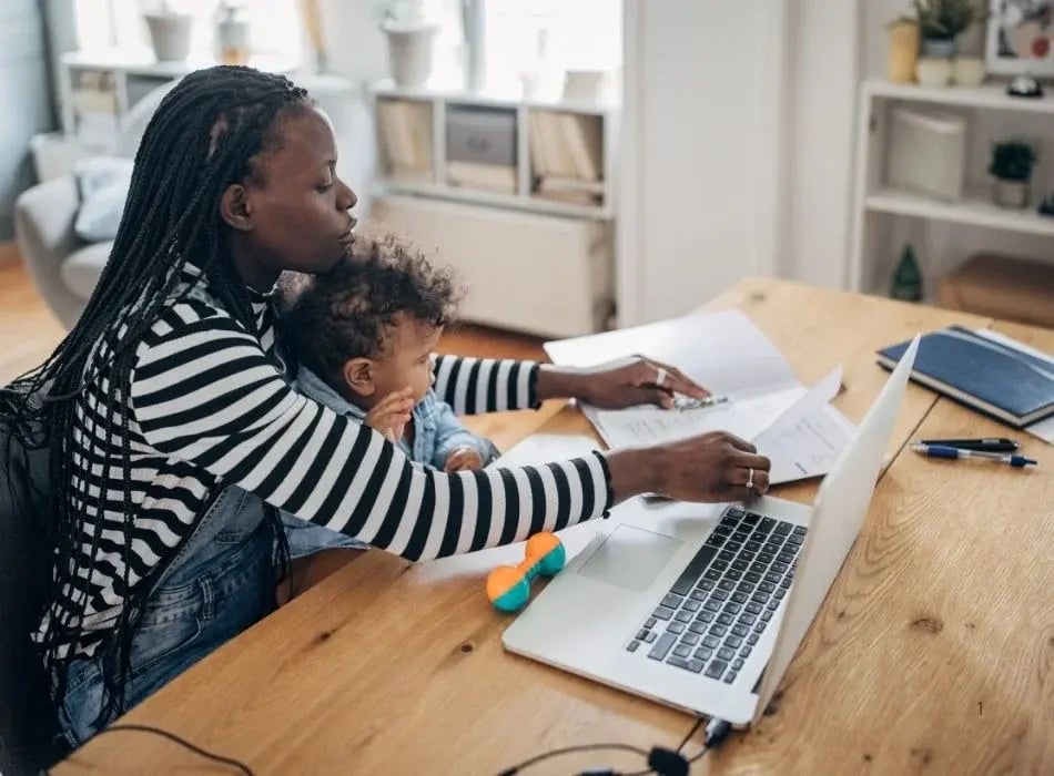mom with child on lap at desk