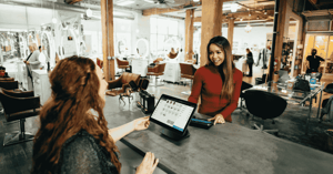 Woman business owner with customer