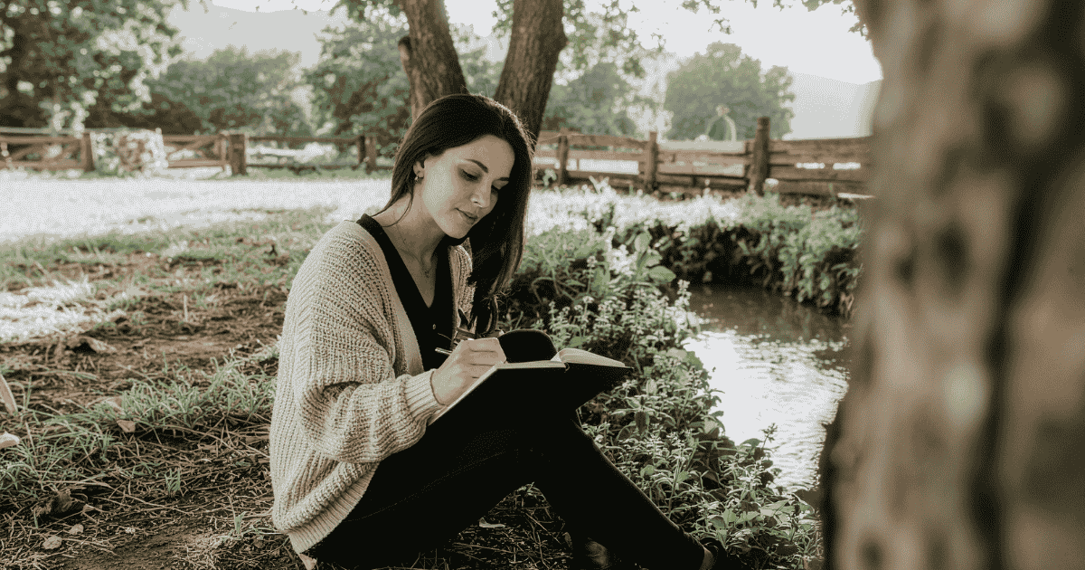 Woman journaling outside