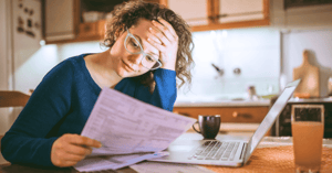 Woman looking over a medical bill