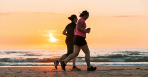 Women running on the beach