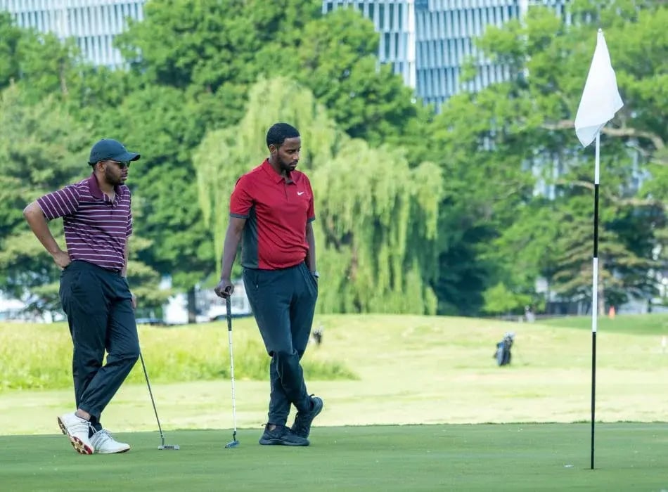 two men golfing