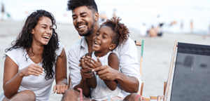black-family-laughing-beach
