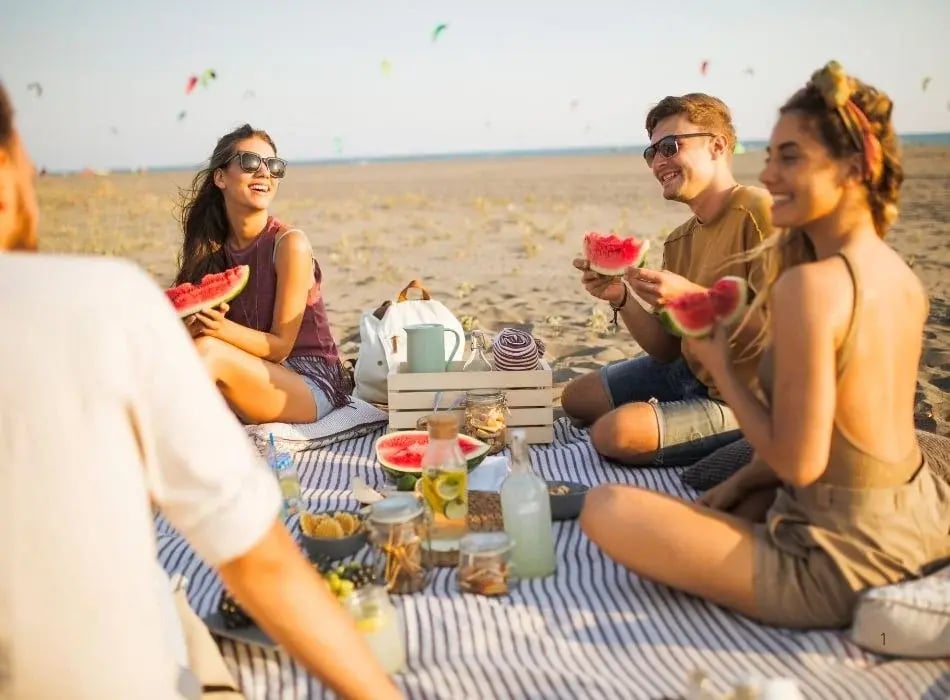 friends at beach picnic