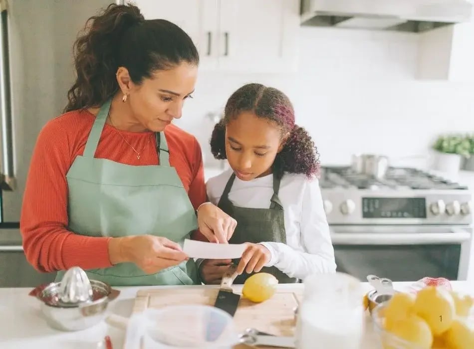 mom and daughter cooking
