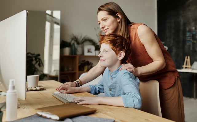 photo-of-woman-teaching-his-son-while-smiling-4145355